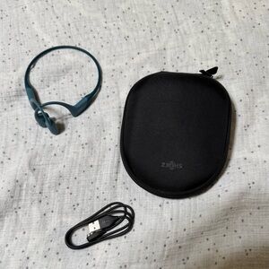 Shokz Bluetooth headphones with case and charger